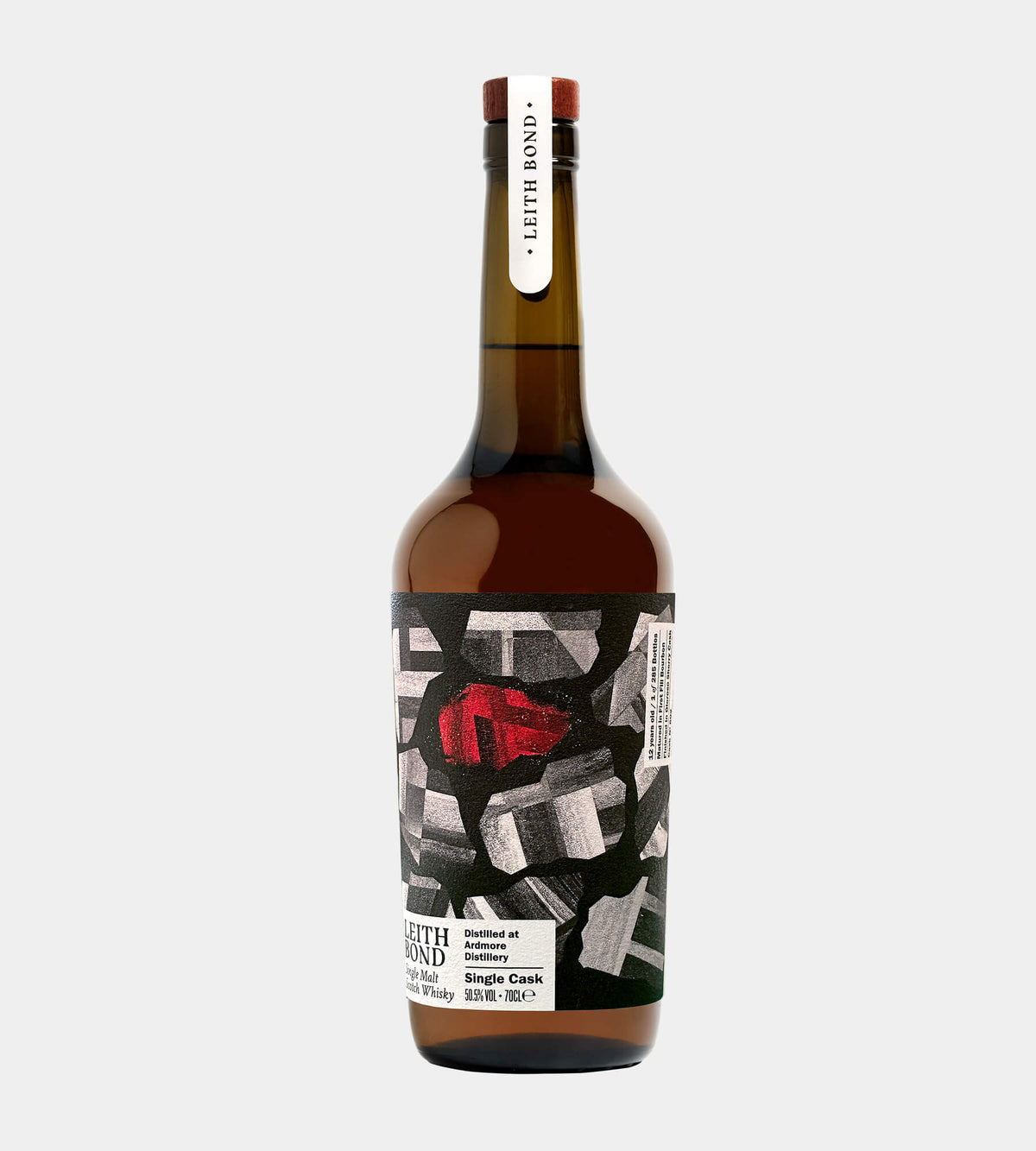 A bottle of Leith Bond single cask whisky  featuring a dark brown glass bottle with a black and white graphic label and a red accent, set against a light gray background